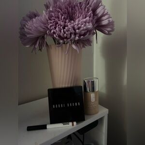 Bobbi Brown Rich Mauve Lip Pencil and highlighter with Clinique foundation.